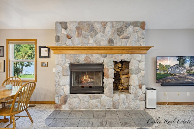 interior space featuring a fireplace and baseboards