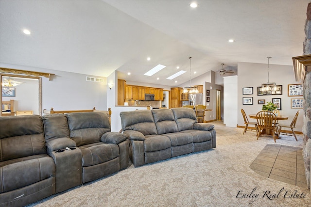 living area with light carpet, visible vents, a ceiling fan, vaulted ceiling, and recessed lighting