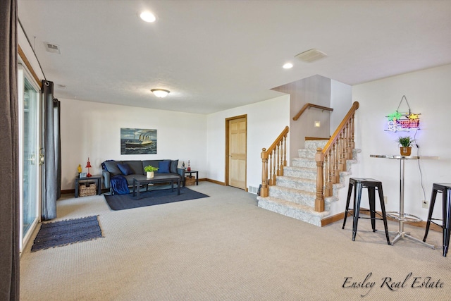 living area with carpet, baseboards, recessed lighting, and stairs