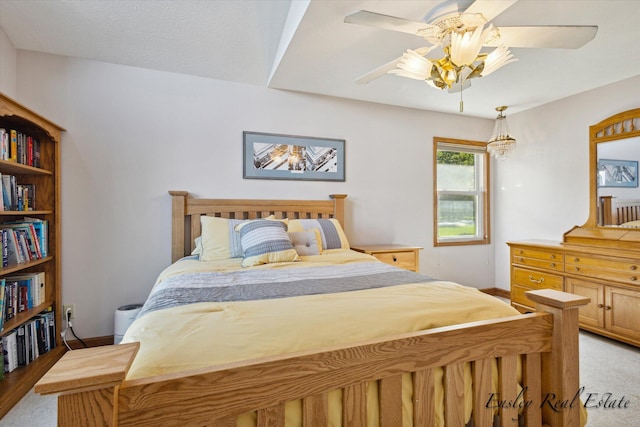 bedroom featuring a ceiling fan and baseboards