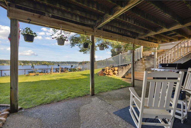 view of patio / terrace with a water view and stairway