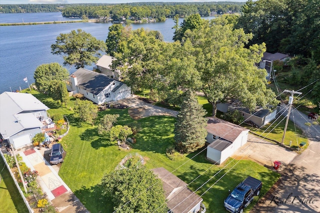 birds eye view of property with a water view