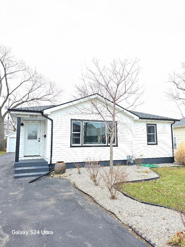 view of front of home with an outdoor structure