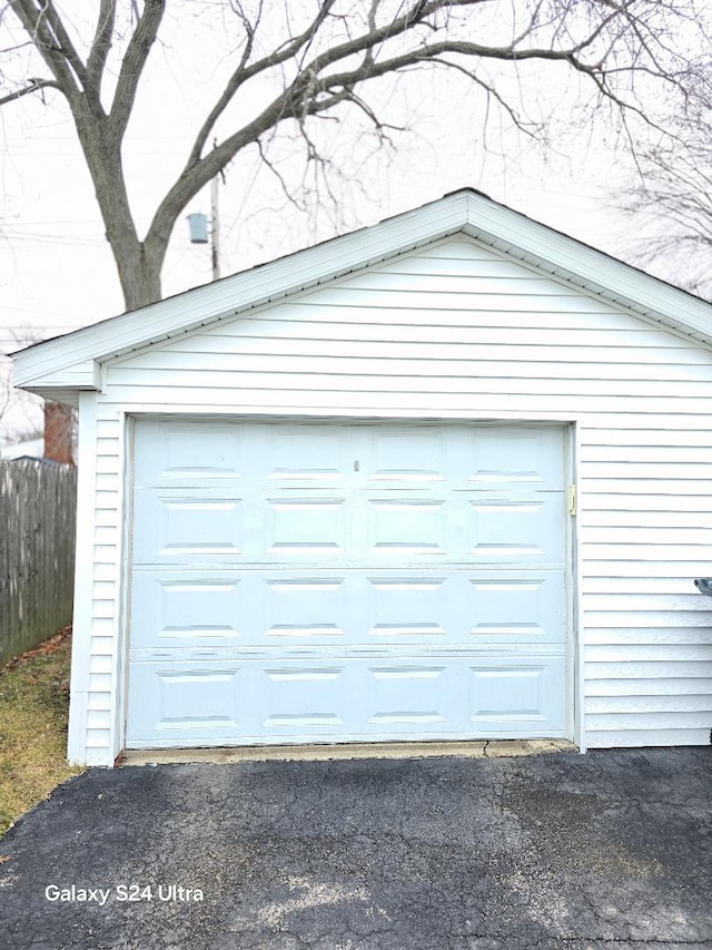 detached garage with fence