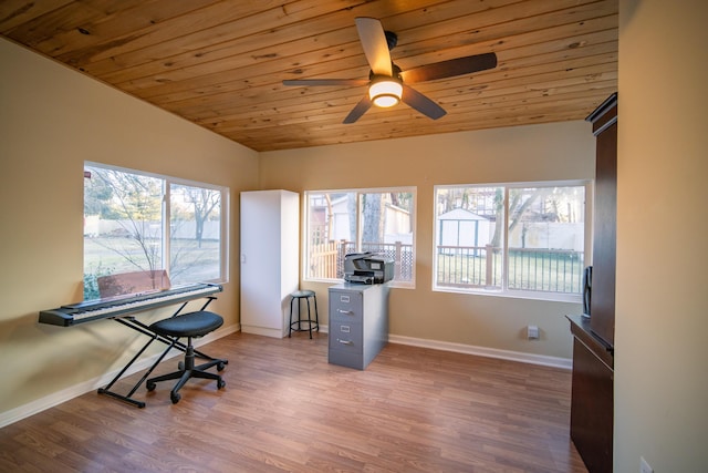 office space featuring a ceiling fan, wood ceiling, vaulted ceiling, wood finished floors, and baseboards