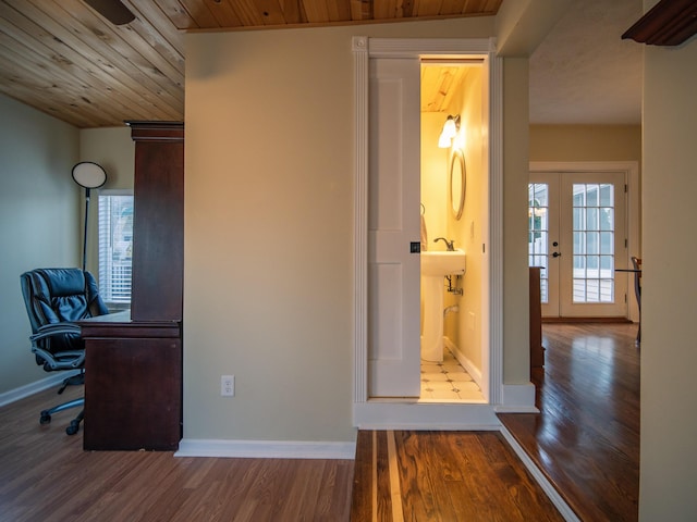 interior space featuring a wealth of natural light, french doors, wooden ceiling, and wood finished floors