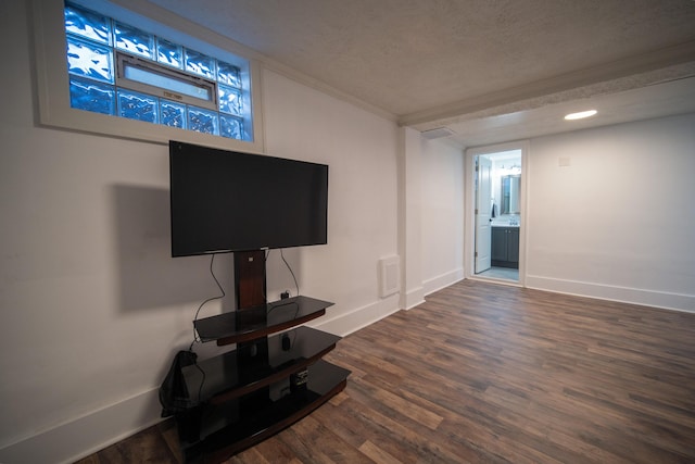 living room with visible vents, a textured ceiling, baseboards, and dark wood-style flooring