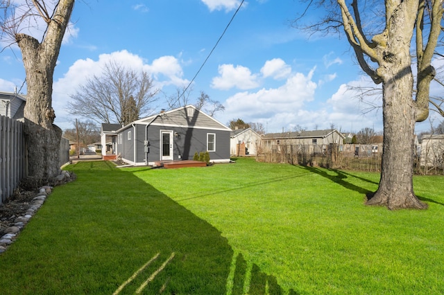 view of yard with a deck and a fenced backyard