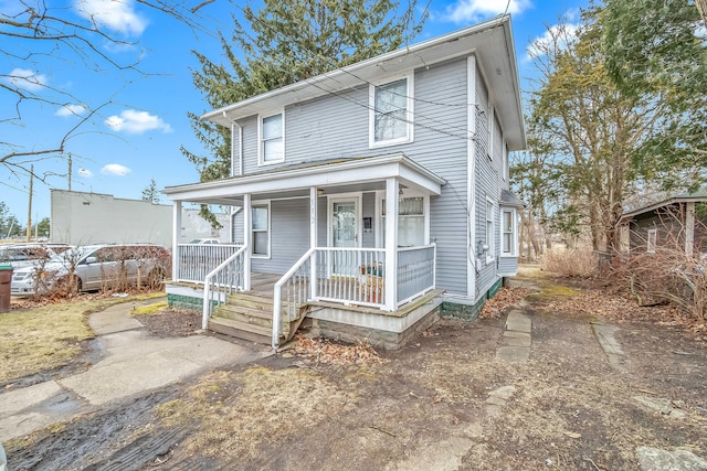 traditional style home with covered porch