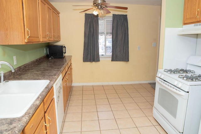 kitchen with ceiling fan, light tile patterned flooring, under cabinet range hood, white appliances, and a sink