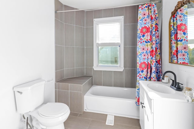 bathroom featuring shower / bath combination with curtain, visible vents, toilet, vanity, and tile patterned floors