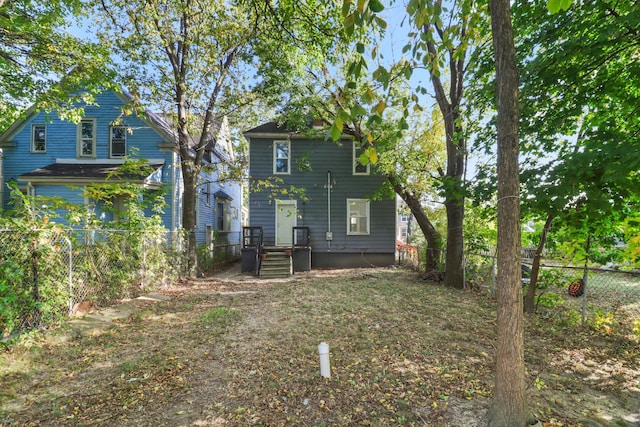 rear view of property with fence private yard