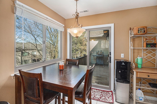 dining room featuring visible vents