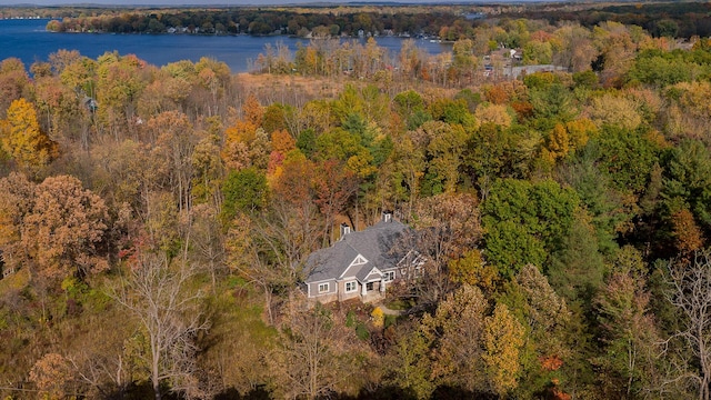 aerial view featuring a water view and a wooded view