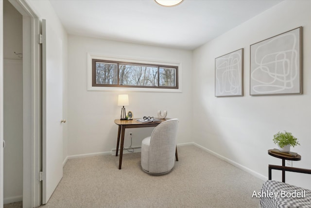 carpeted office space featuring baseboards