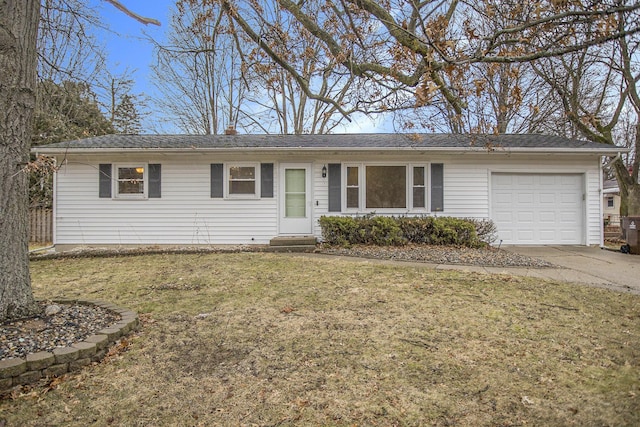 ranch-style home featuring a garage, concrete driveway, a front lawn, and entry steps