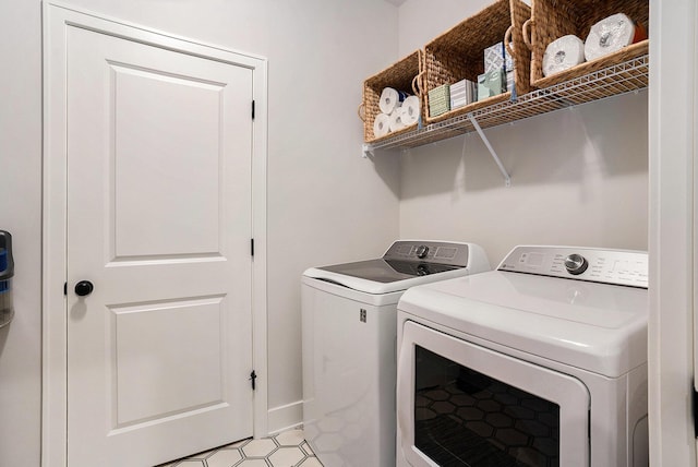 laundry room with laundry area and washer and clothes dryer