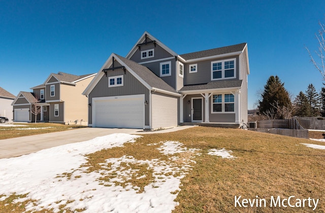 view of front facade with a garage, driveway, a front lawn, and board and batten siding