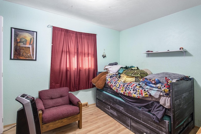 bedroom with wood finished floors