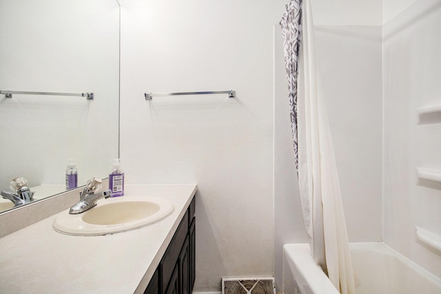 full bathroom featuring shower / bath combination with curtain, vanity, and visible vents