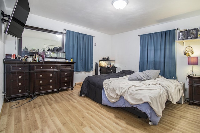 bedroom featuring wood finished floors