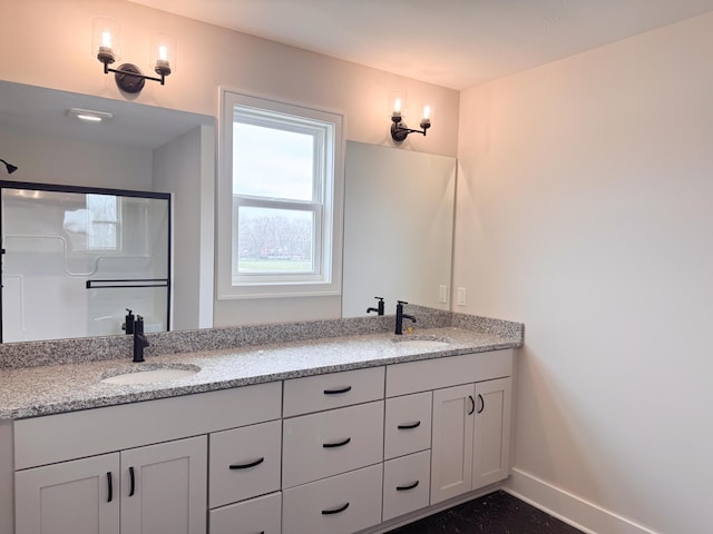 10712 Melanie Dr, Allendale, MI 49401 - full bathroom featuring baseboards, a sink, and double vanity