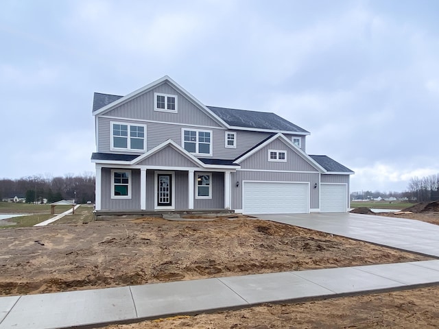 10712 Melanie Dr, Allendale, MI 49401 - craftsman inspired home featuring a porch, an attached garage, concrete driveway, and roof with shingles