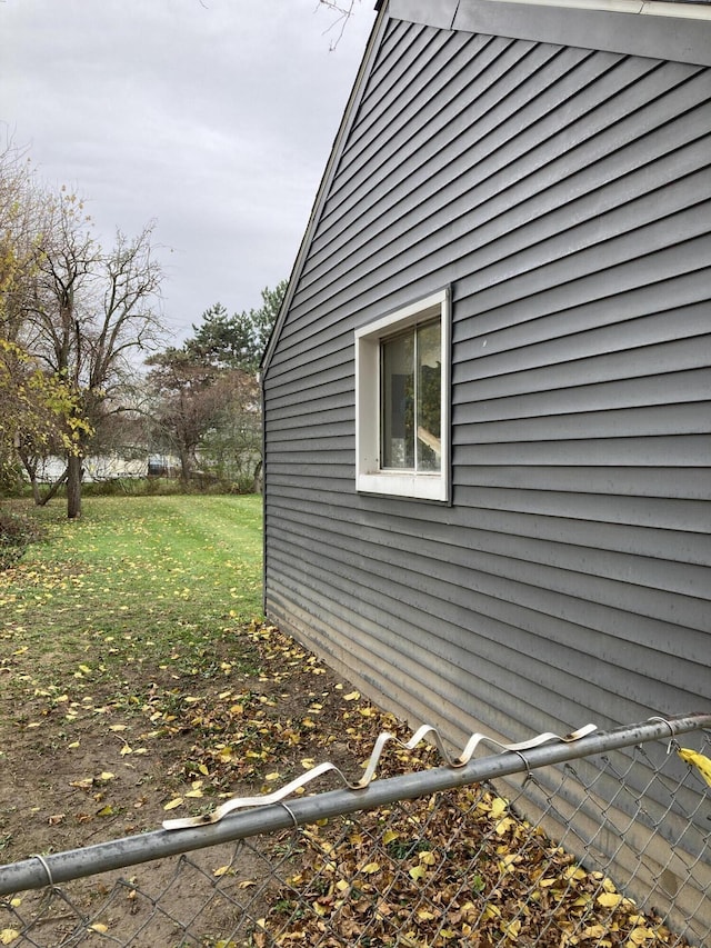 view of home's exterior featuring a lawn