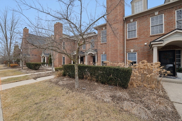 view of front of property featuring brick siding