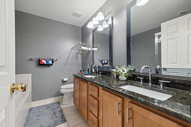 full bath featuring toilet, tile patterned flooring, visible vents, and a sink