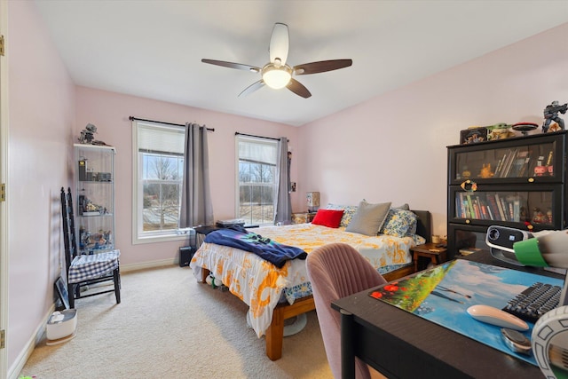 bedroom with carpet floors, ceiling fan, and baseboards