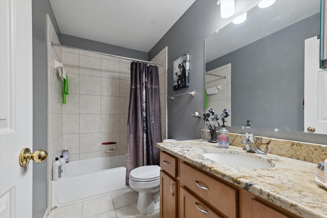 bathroom featuring shower / bath combo with shower curtain, vanity, toilet, and tile patterned floors