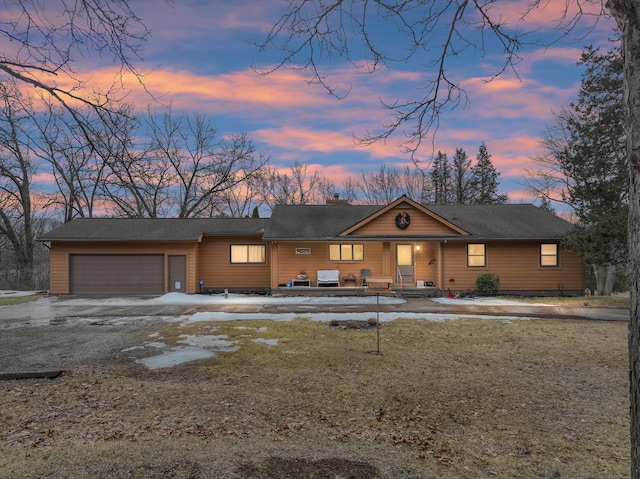 view of front of property with driveway and an attached garage