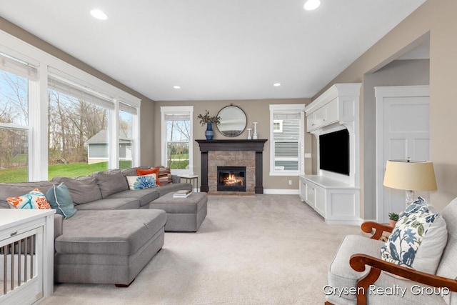 7313 Valhalla Dr, Hudsonville, MI 49426 - living area featuring light colored carpet, recessed lighting, a stone fireplace, and baseboards