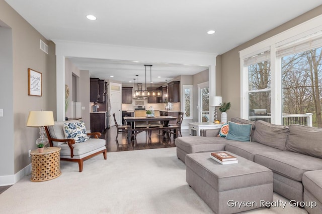 7313 Valhalla Dr, Hudsonville, MI 49426 - carpeted living room with wood finished floors, visible vents, recessed lighting, and baseboards