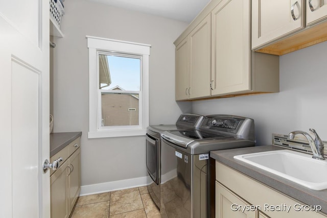 7313 Valhalla Dr, Hudsonville, MI 49426 - washroom featuring a sink, cabinet space, washing machine and clothes dryer, and baseboards
