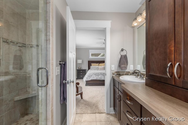 7313 Valhalla Dr, Hudsonville, MI 49426 - bathroom with tile patterned floors, a shower stall, connected bathroom, and vanity
