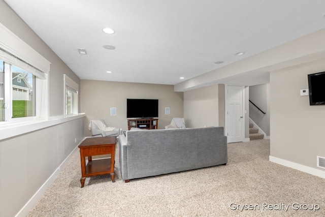 7313 Valhalla Dr, Hudsonville, MI 49426 - carpeted living area featuring baseboards, stairway, visible vents, and recessed lighting