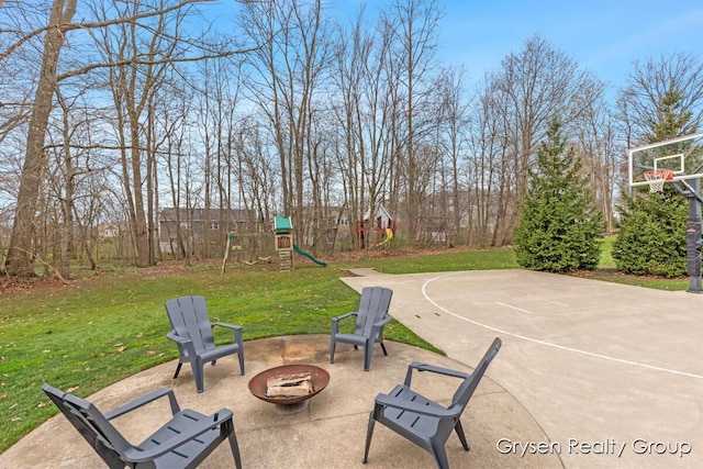 7313 Valhalla Dr, Hudsonville, MI 49426 - view of sport court with a lawn, basketball hoop, and a playground