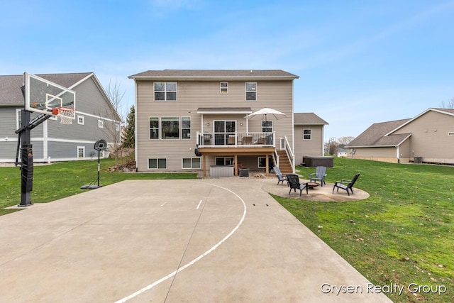 7313 Valhalla Dr, Hudsonville, MI 49426 - view of sport court featuring basketball hoop and a yard
