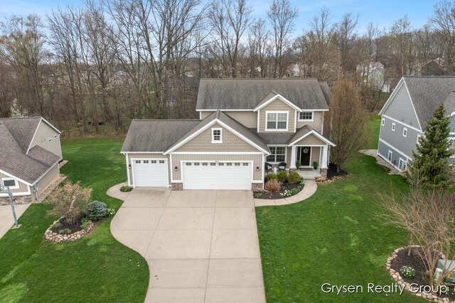 7313 Valhalla Dr, Hudsonville, MI 49426 - craftsman-style house with a garage, a porch, driveway, and a front yard