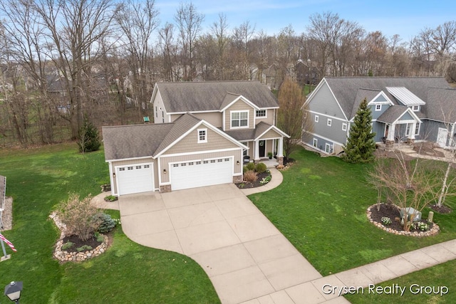 7313 Valhalla Dr, Hudsonville, MI 49426 - view of front of house featuring a front lawn, driveway, stone siding, and a garage