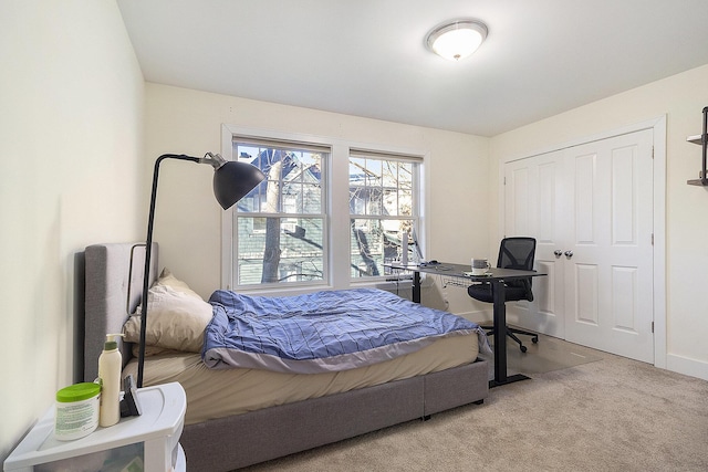 bedroom with carpet floors and baseboards