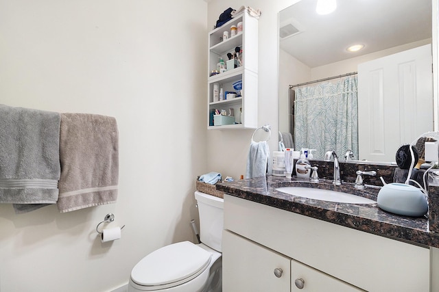 full bath featuring visible vents, vanity, and toilet