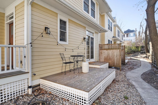 wooden terrace with a residential view