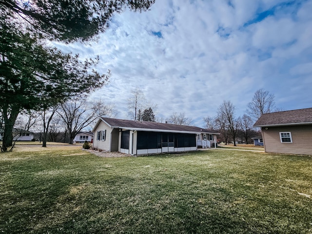 view of yard with a sunroom