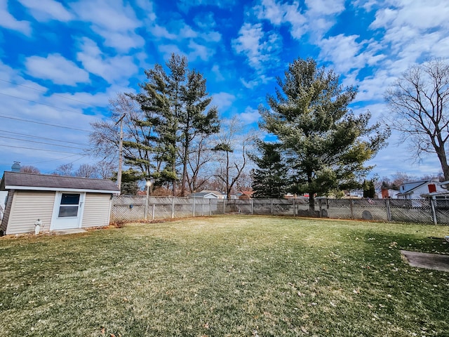 view of yard featuring an outbuilding and a fenced backyard