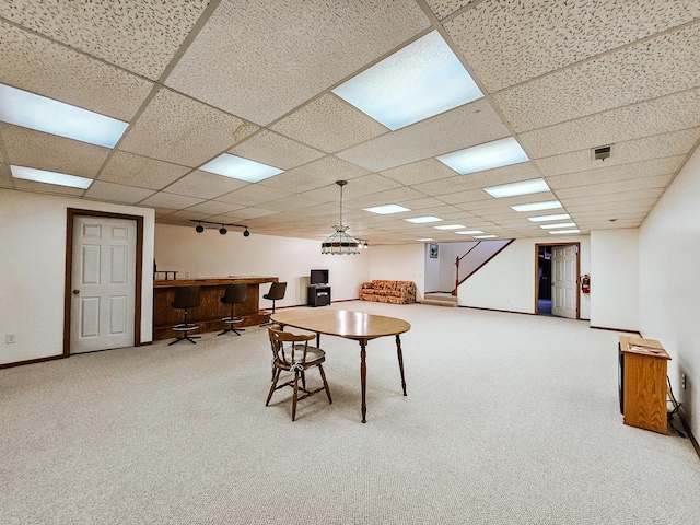 rec room featuring carpet, a paneled ceiling, and baseboards