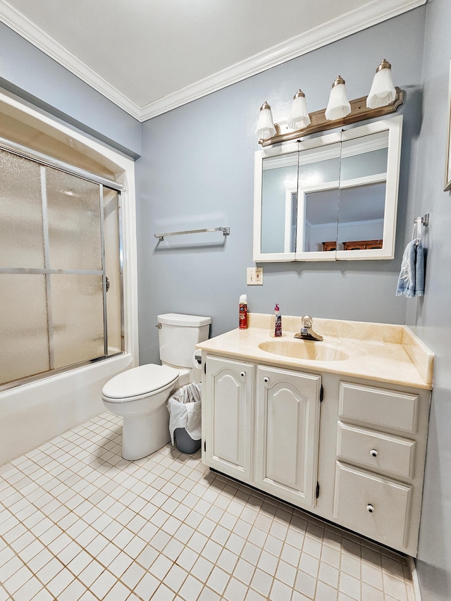 bathroom featuring tile patterned flooring, toilet, vanity, combined bath / shower with glass door, and crown molding