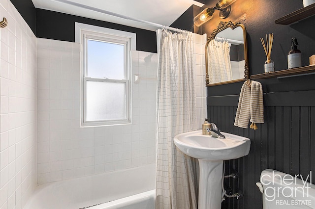 bathroom with shower / bath combination with curtain